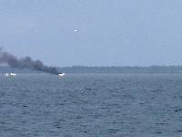 A powerboat burning in upper Tampa Bay. Little Rum tried to assist, but the water was too shallow. No injuries reported.